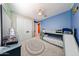 Well-lit bedroom showcasing a bunk bed with slide, soft carpet, and plenty of space for activities at 3907 S 75Th Dr, Phoenix, AZ 85043