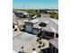 Aerial view of a home showing a three-car garage, paved driveway, neutral color palette, and well-maintained landscaping at 3907 S 75Th Dr, Phoenix, AZ 85043