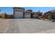 Charming single-Gathering home features a three-car garage and a well-manicured front yard with desert landscaping at 3907 S 75Th Dr, Phoenix, AZ 85043