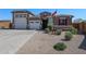Charming home exterior with a well-manicured front yard and a three car garage at 3907 S 75Th Dr, Phoenix, AZ 85043