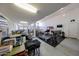 Spacious three-car garage, featuring multiple vehicles and home gym equipment at 3907 S 75Th Dr, Phoenix, AZ 85043