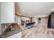 Bright and spacious kitchen with center island and barstool seating, stainless appliances, and ample counter space at 3907 S 75Th Dr, Phoenix, AZ 85043