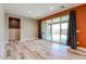 Living room features a sliding glass door with outdoor access, and an adjoining half bathroom at 3907 S 75Th Dr, Phoenix, AZ 85043