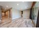 Spacious living room with sliding glass doors, open floor plan, and wood-look tile flooring throughout the home at 3907 S 75Th Dr, Phoenix, AZ 85043