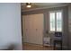 Bedroom featuring ceiling fan, a wardrobe, tiled floor, and shuttered window at 429 N San Ricardo N Trl, Casa Grande, AZ 85194