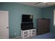 Bedroom featuring large flat screen TV and built-in fireplace at 429 N San Ricardo N Trl, Casa Grande, AZ 85194