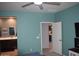 Bedroom featuring attached bath, ceiling fan and neutral decor at 429 N San Ricardo N Trl, Casa Grande, AZ 85194