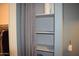 Linen closet featuring shelves and curtain rod at 429 N San Ricardo N Trl, Casa Grande, AZ 85194