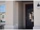 Inviting front entrance with a decorative security screen door and classic exterior lighting at 429 N San Ricardo N Trl, Casa Grande, AZ 85194