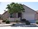 Charming single-story home with desert landscaping and a two-car garage at 429 N San Ricardo N Trl, Casa Grande, AZ 85194