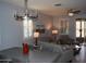 Open-concept living and dining area with modern lighting and neutral color palette at 429 N San Ricardo N Trl, Casa Grande, AZ 85194