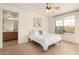 Bright bedroom with tile floors and a view to the outside at 43142 N Outer Bank Dr, Anthem, AZ 85086