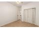 Bedroom with tile floors and closet at 43142 N Outer Bank Dr, Anthem, AZ 85086