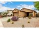 Charming single-story home featuring xeriscape front yard and attached two-car garage at 43142 N Outer Bank Dr, Anthem, AZ 85086