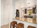 Kitchen with granite counters, breakfast bar, stainless appliances, and dark cabinets at 43142 N Outer Bank Dr, Anthem, AZ 85086