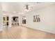 Open living room with tile floors with open access to the kitchen and backyard at 43142 N Outer Bank Dr, Anthem, AZ 85086