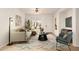 Living room featuring tile floors, modern furniture, and a ceiling fan at 43142 N Outer Bank Dr, Anthem, AZ 85086