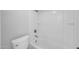 Bright bathroom featuring a white shower-tub combination and toilet at 4554 E Paradise Village Pkwy # 161, Phoenix, AZ 85032