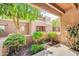 Exterior of apartment building with well-maintained landscaping and mature trees at 4554 E Paradise Village Pkwy # 161, Phoenix, AZ 85032