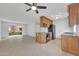 Open kitchen featuring wood cabinets, granite counters, stainless steel appliances, and a breakfast bar at 4554 E Paradise Village Pkwy # 161, Phoenix, AZ 85032