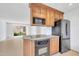 The kitchen features wood cabinets, granite countertops, and stainless steel appliances at 4554 E Paradise Village Pkwy # 161, Phoenix, AZ 85032