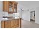 Open kitchen featuring wood cabinets, granite counters, and stainless steel appliances at 4554 E Paradise Village Pkwy # 161, Phoenix, AZ 85032