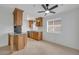 The kitchen features wood cabinets, granite countertops, and stainless steel appliances at 4554 E Paradise Village Pkwy # 161, Phoenix, AZ 85032
