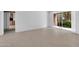 Bright living room features tile flooring and large sliding glass doors leading to the backyard at 4554 E Paradise Village Pkwy # 161, Phoenix, AZ 85032
