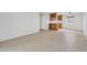Bright living room features tile flooring and open floor plan connecting to the kitchen at 4554 E Paradise Village Pkwy # 161, Phoenix, AZ 85032