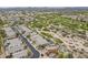 An elevated view of homes bordering a golf course, highlighting lush greenery against a desert landscape at 4864 E Eden Dr, Cave Creek, AZ 85331