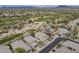Aerial shot of homes in a desert community bordering a lush golf course at 4864 E Eden Dr, Cave Creek, AZ 85331