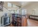 This is a beautiful bar with wood finish, complete with wine fridge, sink and bar accessories at 4864 E Eden Dr, Cave Creek, AZ 85331