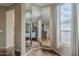 Corner of bedroom with floor-to-ceiling mirrors, light colored walls, and window to the right at 4864 E Eden Dr, Cave Creek, AZ 85331