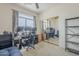 Bright bedroom with office setup, offering functionality and style in one space, with a view to the backyard at 4864 E Eden Dr, Cave Creek, AZ 85331
