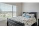 Bed with patterned coverlet and large window view of golf course and desert landscape at 4864 E Eden Dr, Cave Creek, AZ 85331