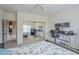 Bedroom with carpet, bed, dual monitors, closet with mirror, and bright light at 4864 E Eden Dr, Cave Creek, AZ 85331