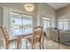 Inviting dining area adjacent to the living room with natural light and view to backyard at 4864 E Eden Dr, Cave Creek, AZ 85331