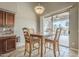 Bright dining area featuring a wood table set with backyard and pool views at 4864 E Eden Dr, Cave Creek, AZ 85331