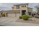 Inviting two-story home with a spacious three-car garage and desert-friendly landscaping at 4864 E Eden Dr, Cave Creek, AZ 85331