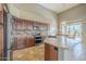 Gourmet kitchen with island, stainless appliances, granite countertops, and ample cabinet space at 4864 E Eden Dr, Cave Creek, AZ 85331