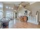Spacious living room with a bar, pool table, hardwood floors, and access to other parts of the home at 4864 E Eden Dr, Cave Creek, AZ 85331