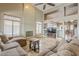 Spacious living room with a cozy fireplace and open layout, filled with natural light at 4864 E Eden Dr, Cave Creek, AZ 85331