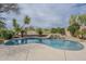 Inviting private pool with rock waterfall feature, surrounded by desert landscaping and decorative rocks at 4864 E Eden Dr, Cave Creek, AZ 85331