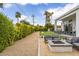 Inviting backyard with a fire pit, lounge chairs, and a well-manicured lawn for outdoor enjoyment at 5036 N Scottsdale Rd, Paradise Valley, AZ 85253