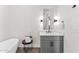 Bright bathroom with soaking tub, gray vanity and modern lighting at 5036 N Scottsdale Rd, Paradise Valley, AZ 85253