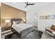 Cozy bedroom features a neutral color palette, ceiling fan and ensuite bathroom at 5036 N Scottsdale Rd, Paradise Valley, AZ 85253