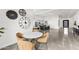 Bright dining area features modern decor, round table, and opens to the spacious kitchen and living areas at 5036 N Scottsdale Rd, Paradise Valley, AZ 85253