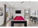 Spacious game room with a pool table, TV, and ample seating at 5036 N Scottsdale Rd, Paradise Valley, AZ 85253