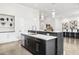 Kitchen island with modern stainless steel appliances and hanging pendant lights at 5036 N Scottsdale Rd, Paradise Valley, AZ 85253