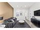 The living room features a cozy couch, modern lighting, and stylish decor with a monochromatic aesthetic at 5036 N Scottsdale Rd, Paradise Valley, AZ 85253